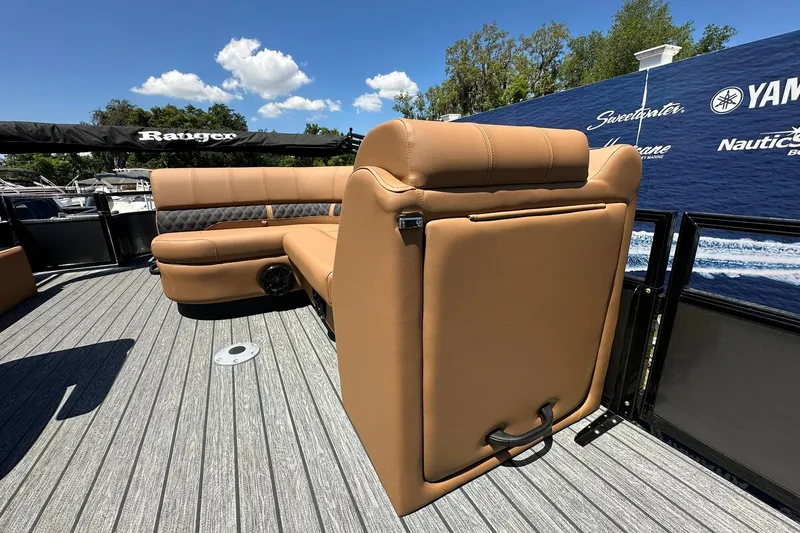 Slide: The Image of 2026 Ranger Reata 220FC boat interior with tan seating and gray flooring. - 15