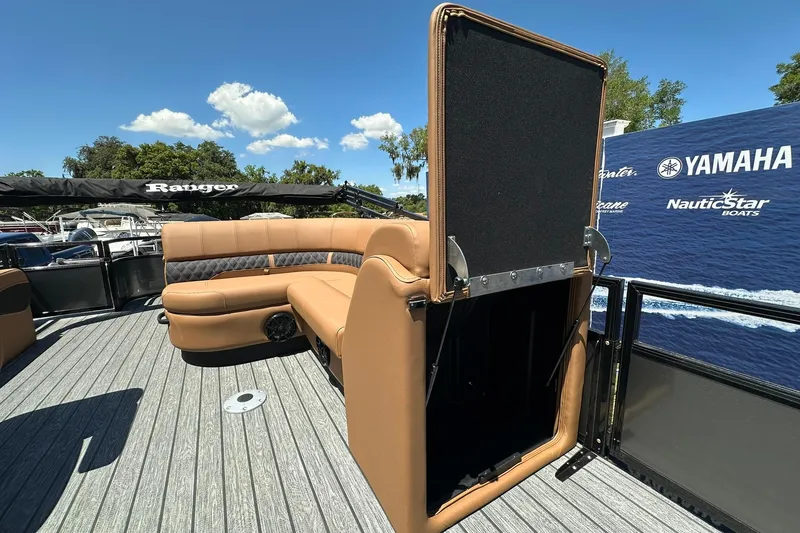 Slide: The Image of 2026 Ranger Reata 220FC boat with tan seating and Yamaha branding in the background. - 16