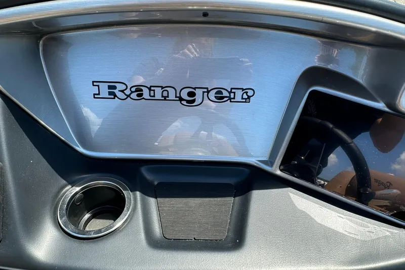 Slide: The Image of Dashboard of 2026 Ranger Reata 220FC boat with logo and cup holder. - 22