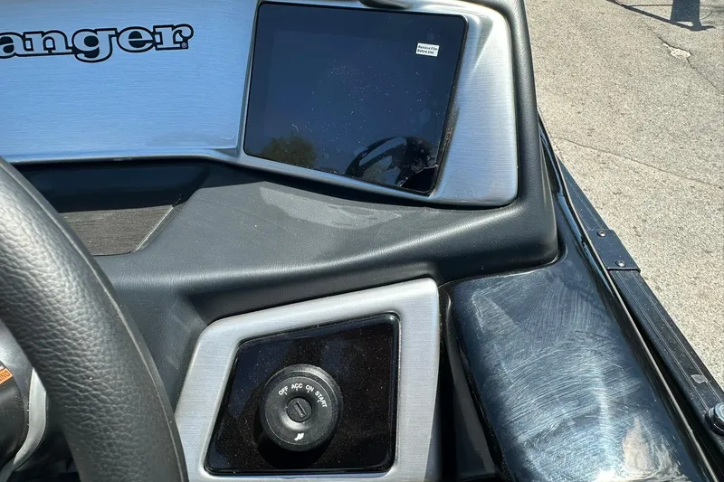 Slide: The Image of Dashboard of 2026 Ranger Reata 220FC boat with steering wheel and control panel. - 23