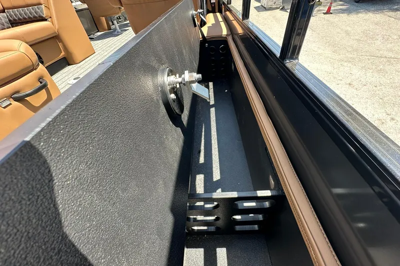 Slide: The Image of 2026 Ranger Reata 220FC interior detail with seating and storage compartment. - 27