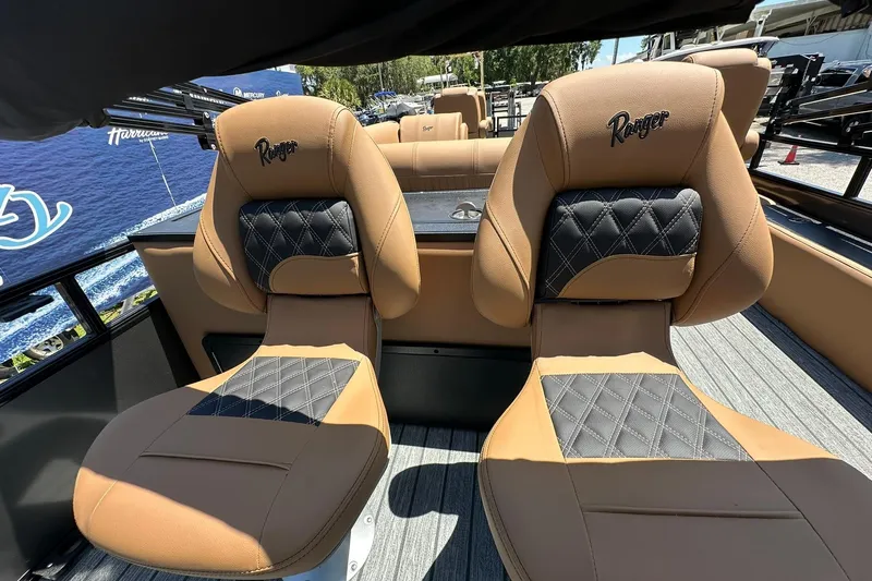 Slide: The Image of Luxurious seating on 2026 Ranger Reata 220FC boat, featuring tan and black upholstery. - 31