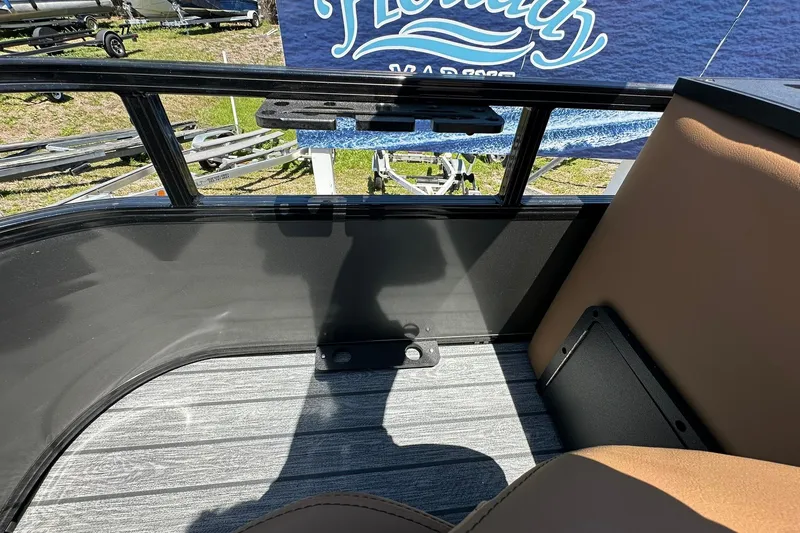 Slide: The Image of Interior view of 2026 Ranger Reata 220FC boat, featuring sleek seating and modern flooring. - 33