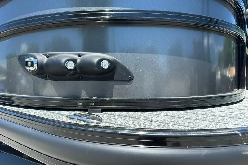 Slide: The Image of 2026 Ranger Reata 220FC boat exterior with sleek black finish and modern lighting. - 41