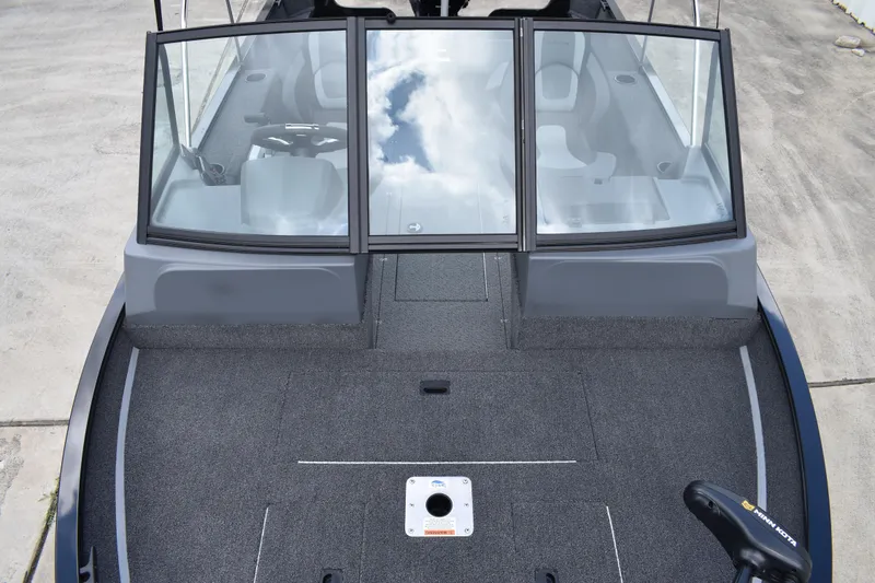 Slide: The Image of 2026 Lowe Fishing Machine 1625WT boat interior with windshield and seating. - 10