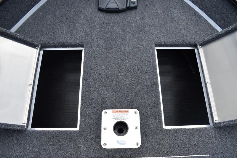 Slide: The Image of 2026 Lowe Fishing Machine 1625WT boat deck with open storage compartments. - 15