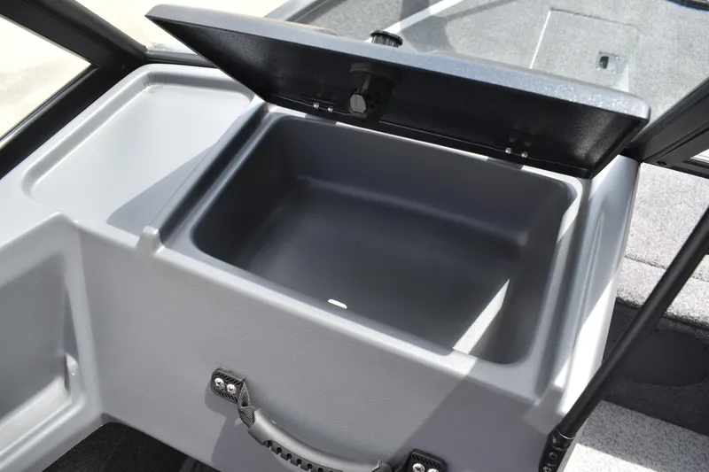 Slide: The Image of 2026 Lowe Fishing Machine 1625WT storage compartment with open lid, showcasing interior space. - 20