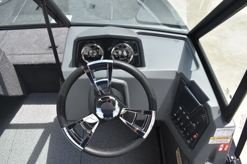 Slide: The Image of 2026 Lowe Fishing Machine 1625WT dashboard with modern steering wheel and instrument panel. - 22