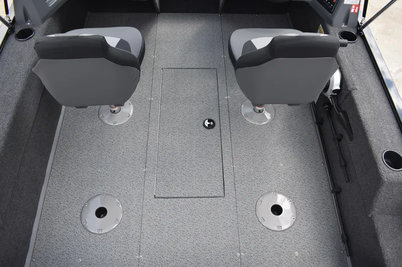 Slide: The Image of 2026 Lowe Fishing Machine 1625WT interior with two seats and carpeted floor. - 25