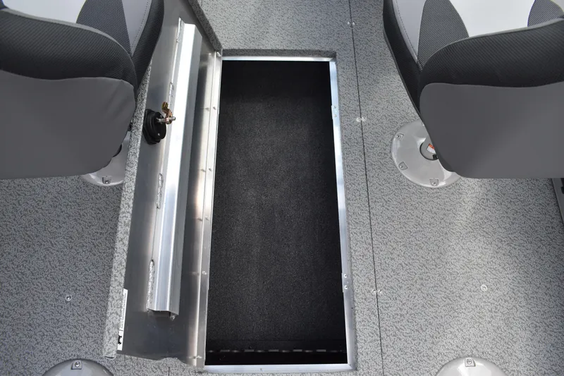 Slide: The Image of 2026 Lowe Fishing Machine 1625WT interior with storage compartment and seating. - 26