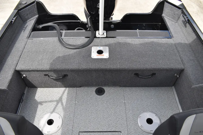 Slide: The Image of 2026 Lowe Fishing Machine 1625WT interior, featuring spacious seating and storage compartments. - 27