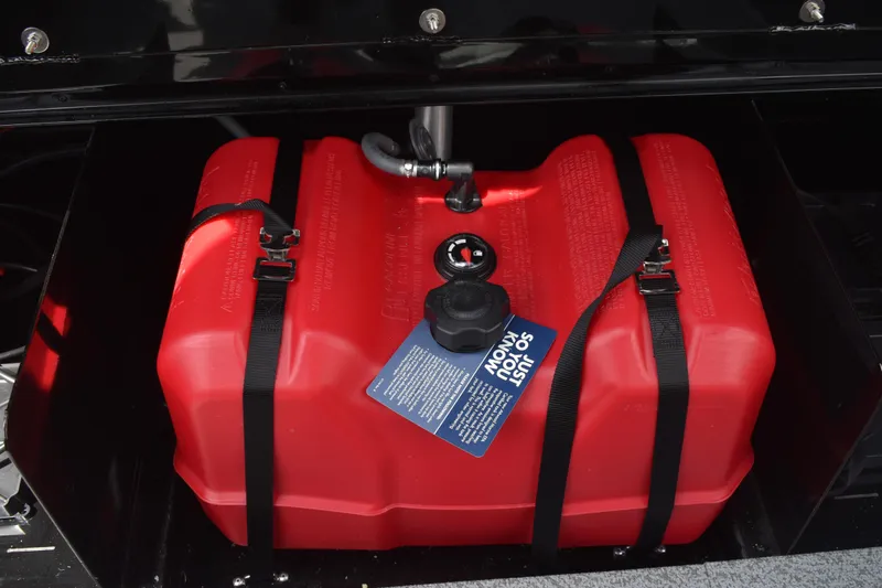 Slide: The Image of Red fuel tank in 2026 Lowe Fishing Machine 1625WT boat, secured with straps. - 28