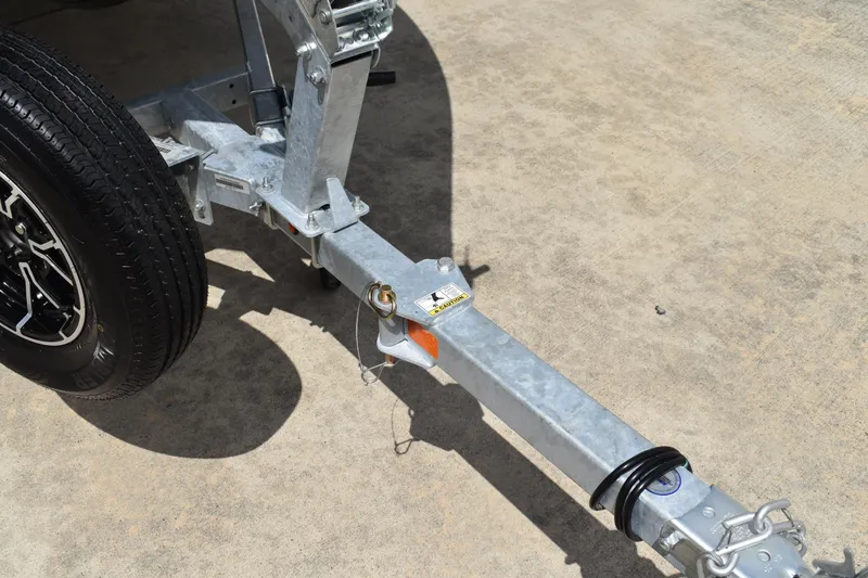 Slide: The Image of Trailer hitch of 2026 Lowe Fishing Machine 1625WT on concrete surface. - 33