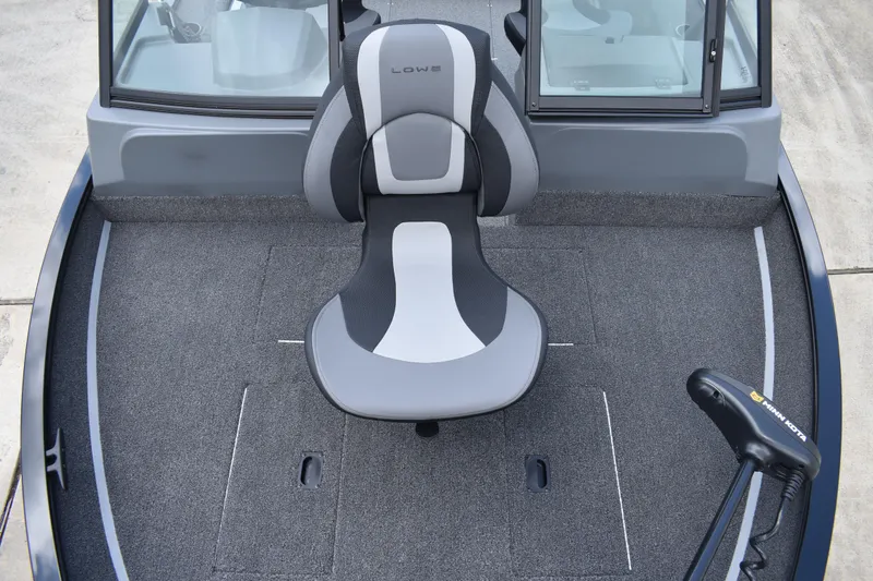 Slide: The Image of 2026 Lowe Fishing Machine 1625WT boat interior with seating and trolling motor. - 9