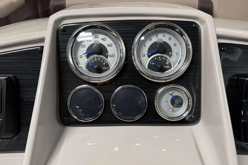 Slide: The Image of Dashboard of 2026 Sylvan Mirage 8520 Cruise with speedometer and fuel gauges. - 10