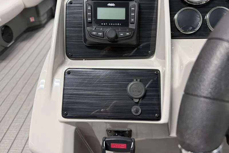 Slide: The Image of Dashboard of 2026 Sylvan Mirage 8520 Cruise with audio controls and gauges. - 11