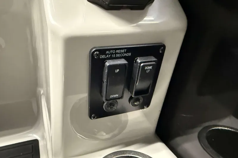 Slide: The Image of Control panel with switches on a 2026 Sylvan Mirage 8520 Cruise boat. - 12