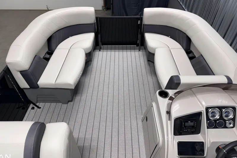 Slide: The Image of 2026 Sylvan Mirage 8520 Cruise interior with plush seating and modern dashboard. - 14