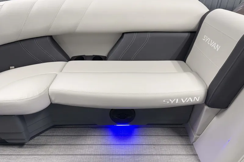 Slide: The Image of Luxurious seating on the 2026 Sylvan Mirage 8520 Cruise pontoon boat with ambient lighting. - 17