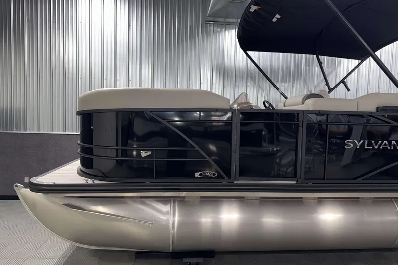 Slide: The Image of 2026 Sylvan Mirage 8520 Cruise pontoon boat in a showroom setting. - 20