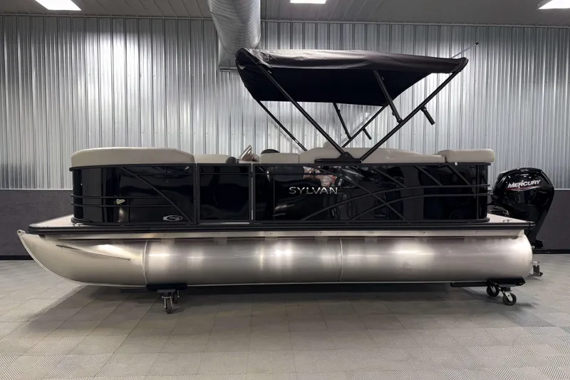 Slide: The Image of 2026 Sylvan Mirage 8520 Cruise pontoon boat in showroom, side view. - 21