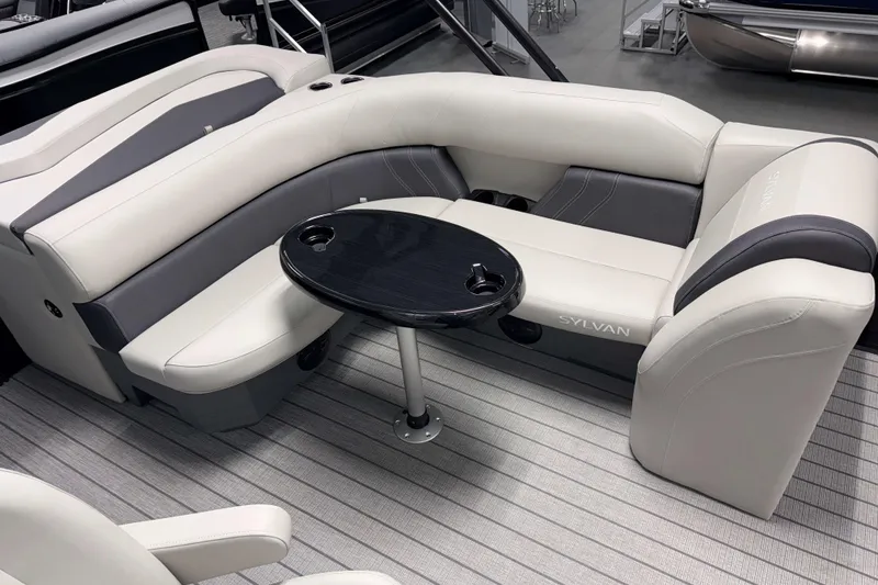 Slide: The Image of Luxurious seating area on 2026 Sylvan Mirage 8520 Cruise pontoon boat with sleek table. - 4