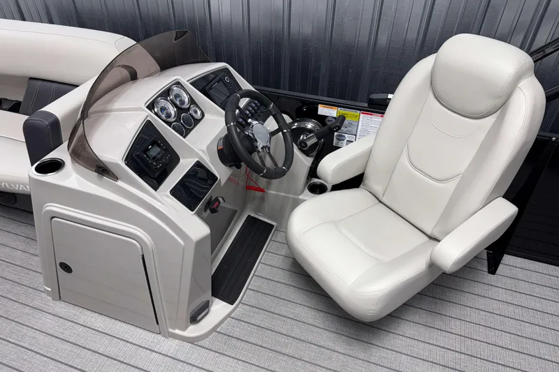 Slide: The Image of Captain's chair and helm of 2026 Sylvan Mirage 8520 Cruise boat, featuring modern controls. - 5
