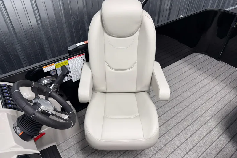 Slide: The Image of Captain's chair and steering wheel of 2026 Sylvan Mirage 8520 Cruise boat. - 7