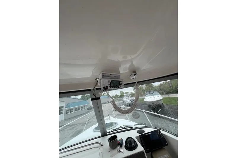 Slide: The Image of 2004 Seaswirl Striper 2601 Walkaround I/O boat interior with navigation equipment. - 5