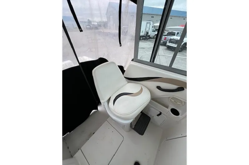 Slide: The Image of 2004 Seaswirl Striper 2601 Walkaround I/O boat interior with white seating. - 7