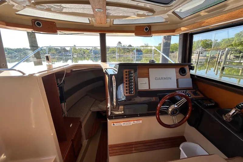 Slide: The Image of Interior view of 2020 Ranger Tugs R-27 boat cockpit with Garmin navigation system. - 12