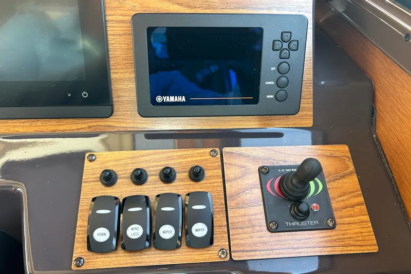 Slide: The Image of Control panel of a 2020 Ranger Tugs R-27 with Yamaha display and thruster joystick. - 13