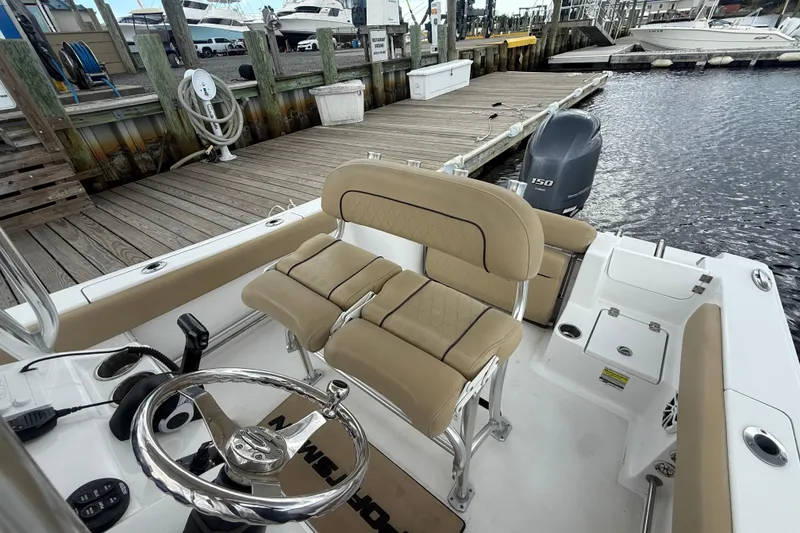 Slide: The Image of 2018 Sportsman Open 212 Center Console boat interior at dockside. - 11
