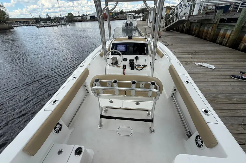 Slide: The Image of 2018 Sportsman Open 212 Center Console boat docked by wooden pier. - 13