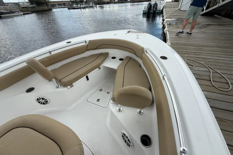 Slide: The Image of 2018 Sportsman Open 212 Center Console boat with tan seating at dock. - 5