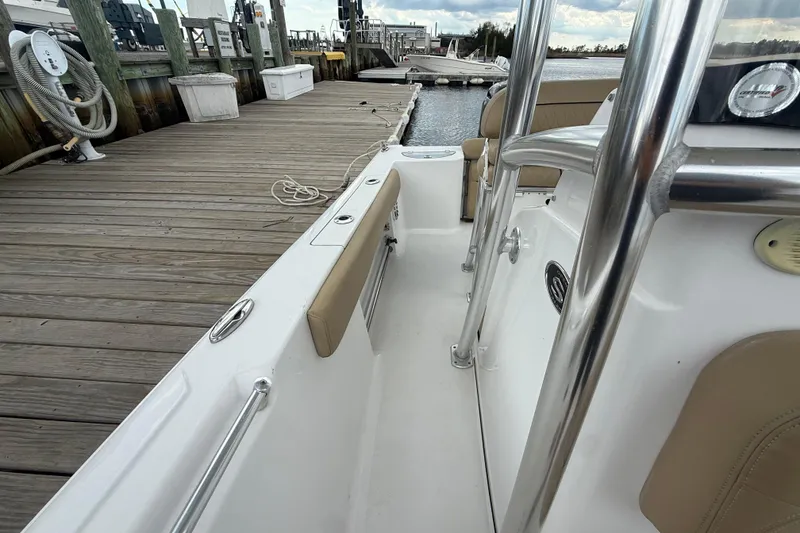 Slide: The Image of 2018 Sportsman Open 212 Center Console docked at a marina, showcasing interior details. - 9
