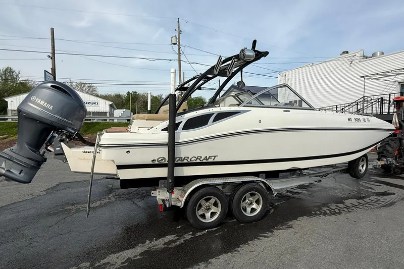 Slide: The Image of 2014 Starcraft Crossover 210 SCX OB boat on trailer with Yamaha outboard motor. - 4
