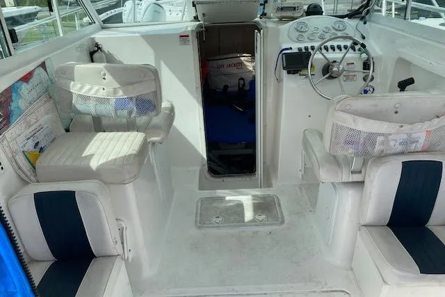 Slide: The Image of 2007 Baha Cruisers 251 GLE boat interior with seating and control panel. - 5