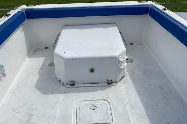 Slide: The Image of 2007 Baha Cruisers 251 GLE boat interior with white and blue seating. - 8