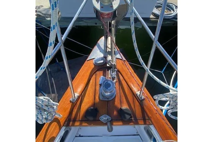 Slide: The Image of Bow of 1982 Endeavour 40 sailboat with polished wood and rigging details. - 11