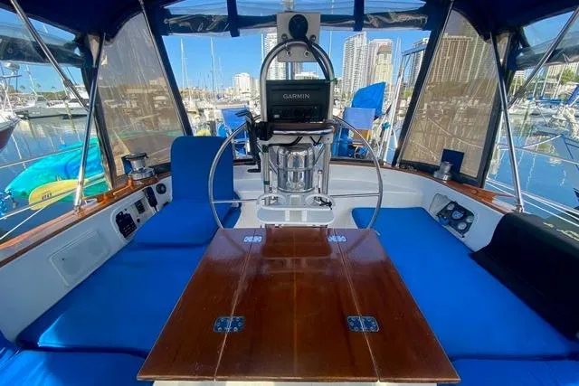 Slide: The Image of Cockpit of 1982 Endeavour 40 sailboat with blue seating and Garmin navigation system. - 21