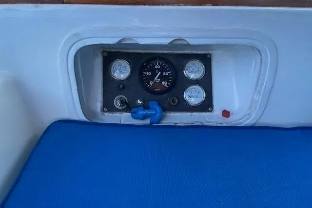 Slide: The Image of Control panel of a 1982 Endeavour 40 sailboat with gauges and blue cushion. - 23