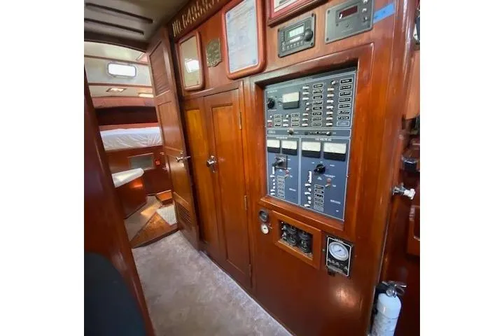 Slide: The Image of Interior of 1982 Endeavour 40 sailboat with control panel and wooden cabinetry. - 51
