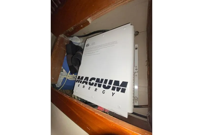Slide: The Image of Magnum Energy inverter inside 1982 Endeavour 40 sailboat compartment. - 67