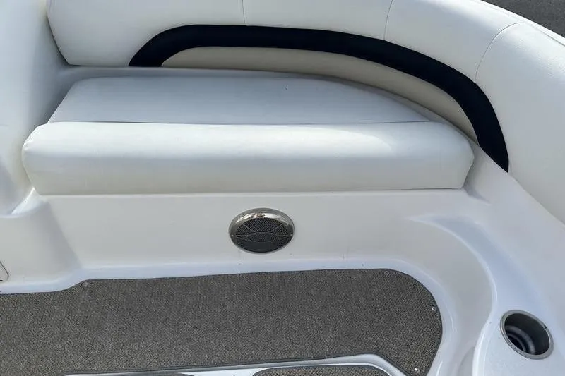 Slide: The Image of 2026 Hurricane FunDeck 196 RE boat interior with cushioned seating and speaker. - 15