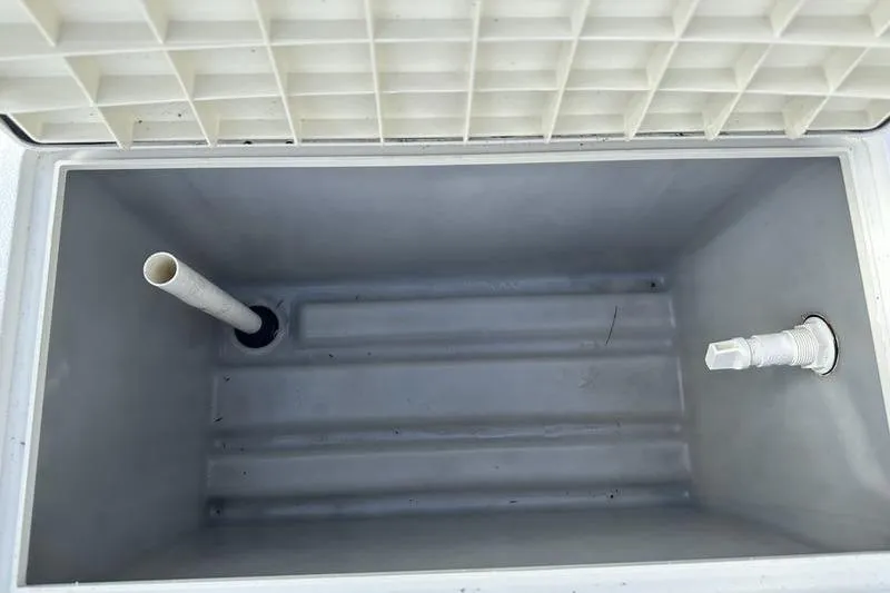 Slide: The Image of Open storage compartment in 2026 Hurricane FunDeck 196 RE boat. - 20