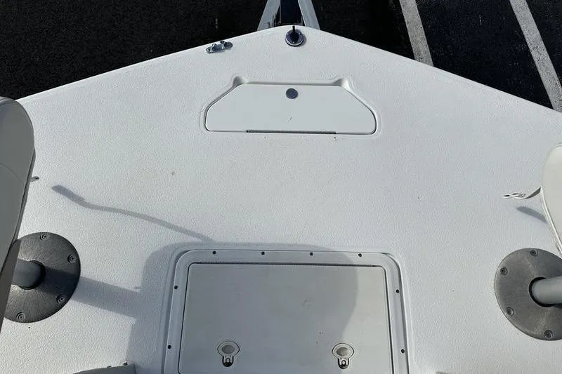 Slide: The Image of 2026 Hurricane FunDeck 196 RE boat deck, featuring storage compartments and seating. - 23