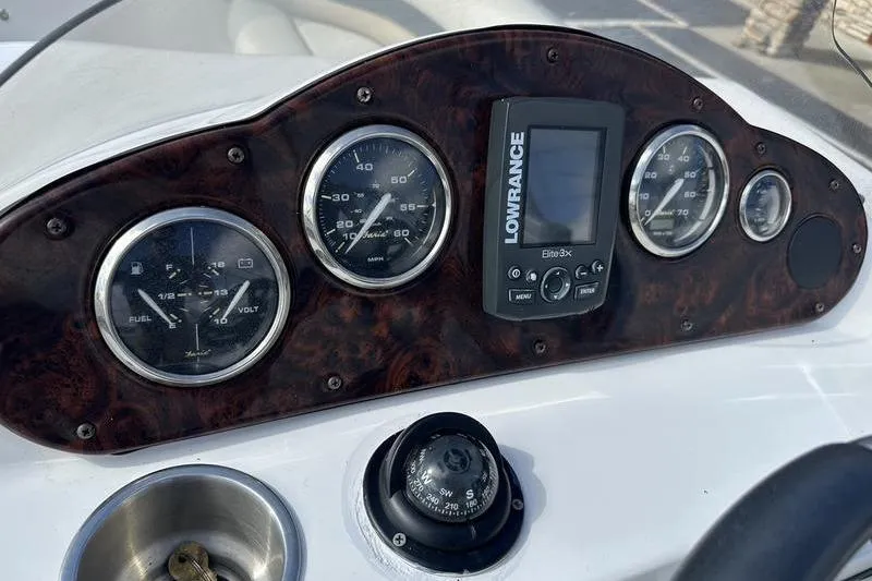 Slide: The Image of Dashboard of 2026 Hurricane FunDeck 196 RE boat with gauges and Lowrance device. - 5