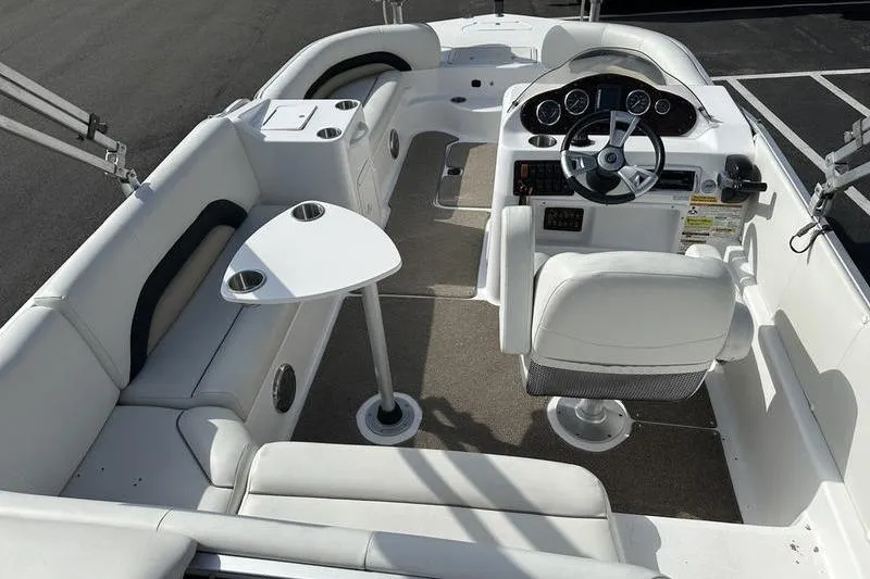 Slide: The Image of 2026 Hurricane FunDeck 196 RE boat interior with white seating and steering console. - 7