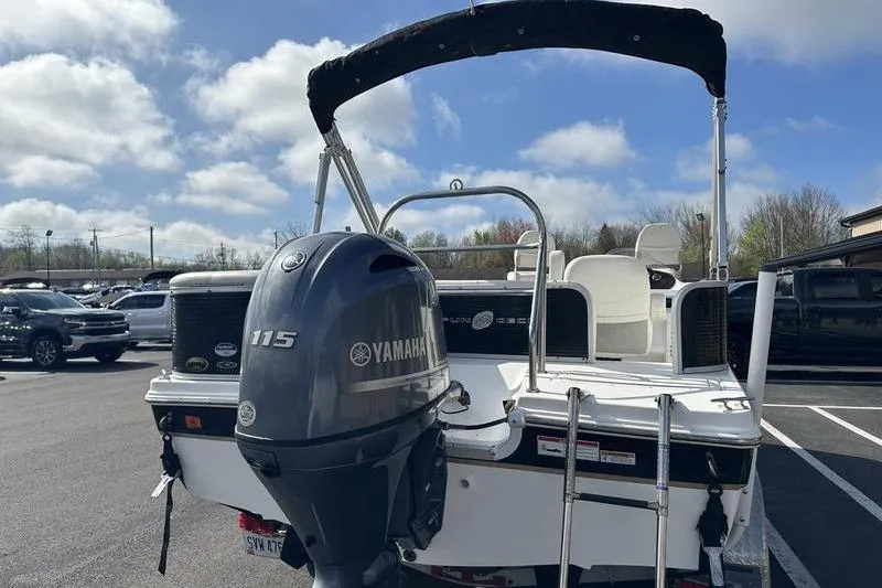 Slide: The Image of 2026 Hurricane FunDeck 196 RE boat with Yamaha 115 engine in parking lot. - 9